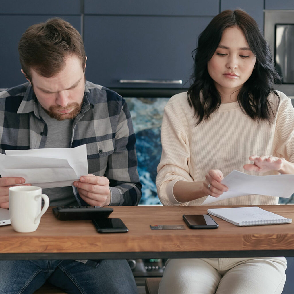 couple looking at their energy bills and energy consumption